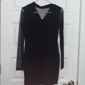 Tight black dress with sheer sleeves